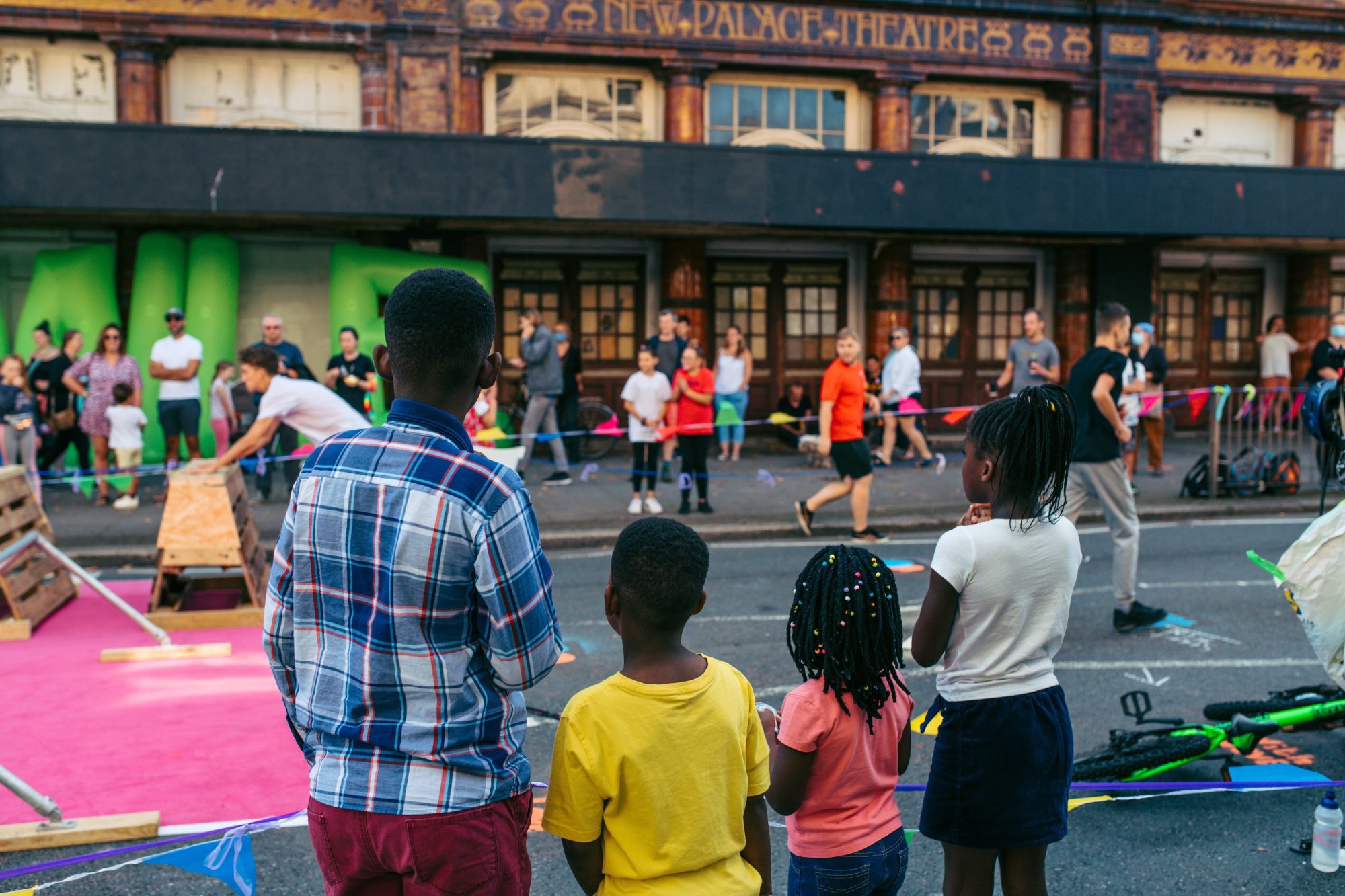 people watching gymnastics on street