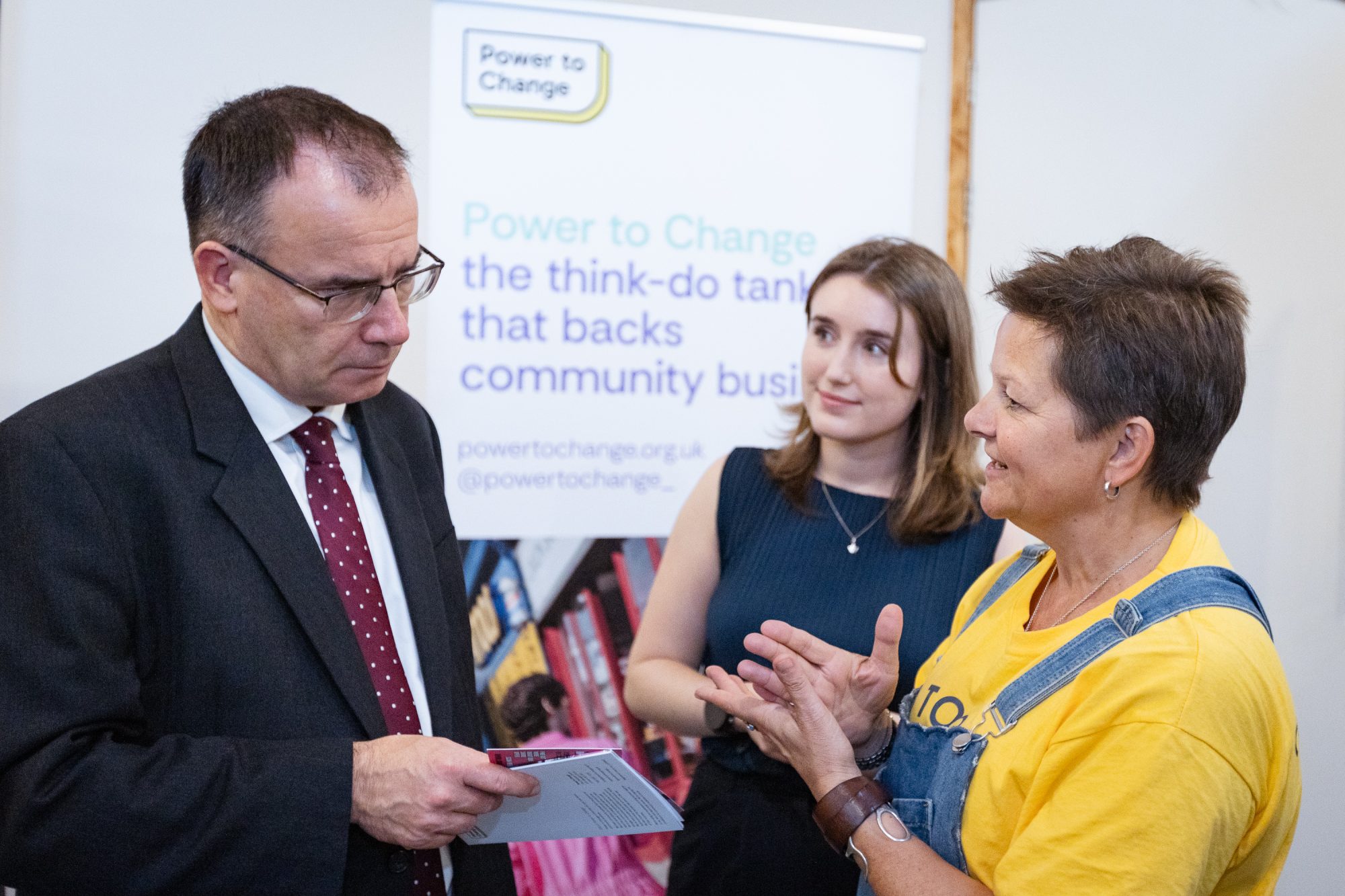 Gareth Thomas MP, Jess Craig, and Deana Coalville talking at an event